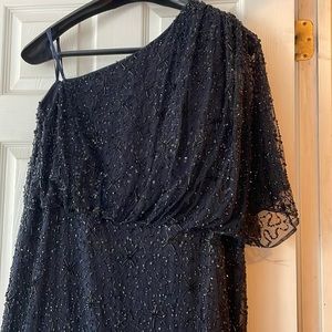 One shoulder gown. Color is deepest navy almost black. blouson top flared bottom